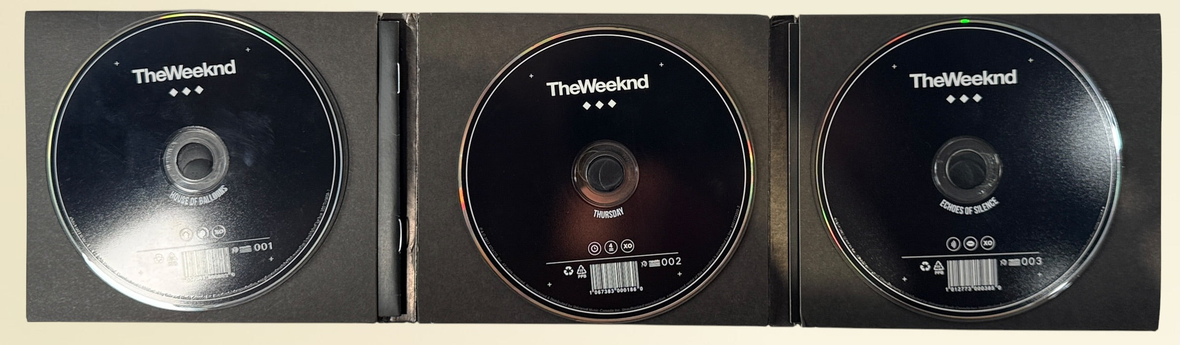 Official 2012 The Weeknd Trilogy 3CD deluxe XO Canada box set with House of Balloons, Thursday, and Echoes of Silence in foldout digipak packaging.