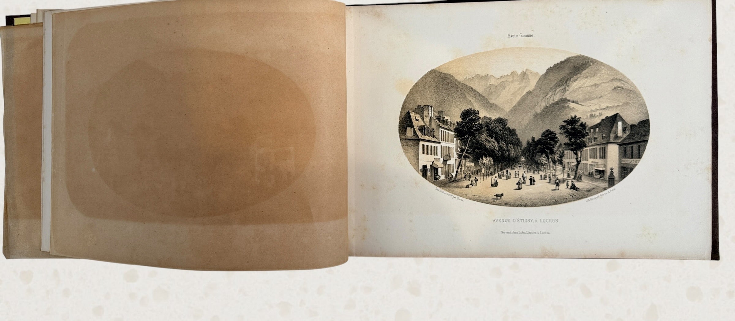 Antique French lithograph album featuring scenic Pyrenees views of Luchon, original 19th-century plates, fold-outs, and gilt decorative binding.