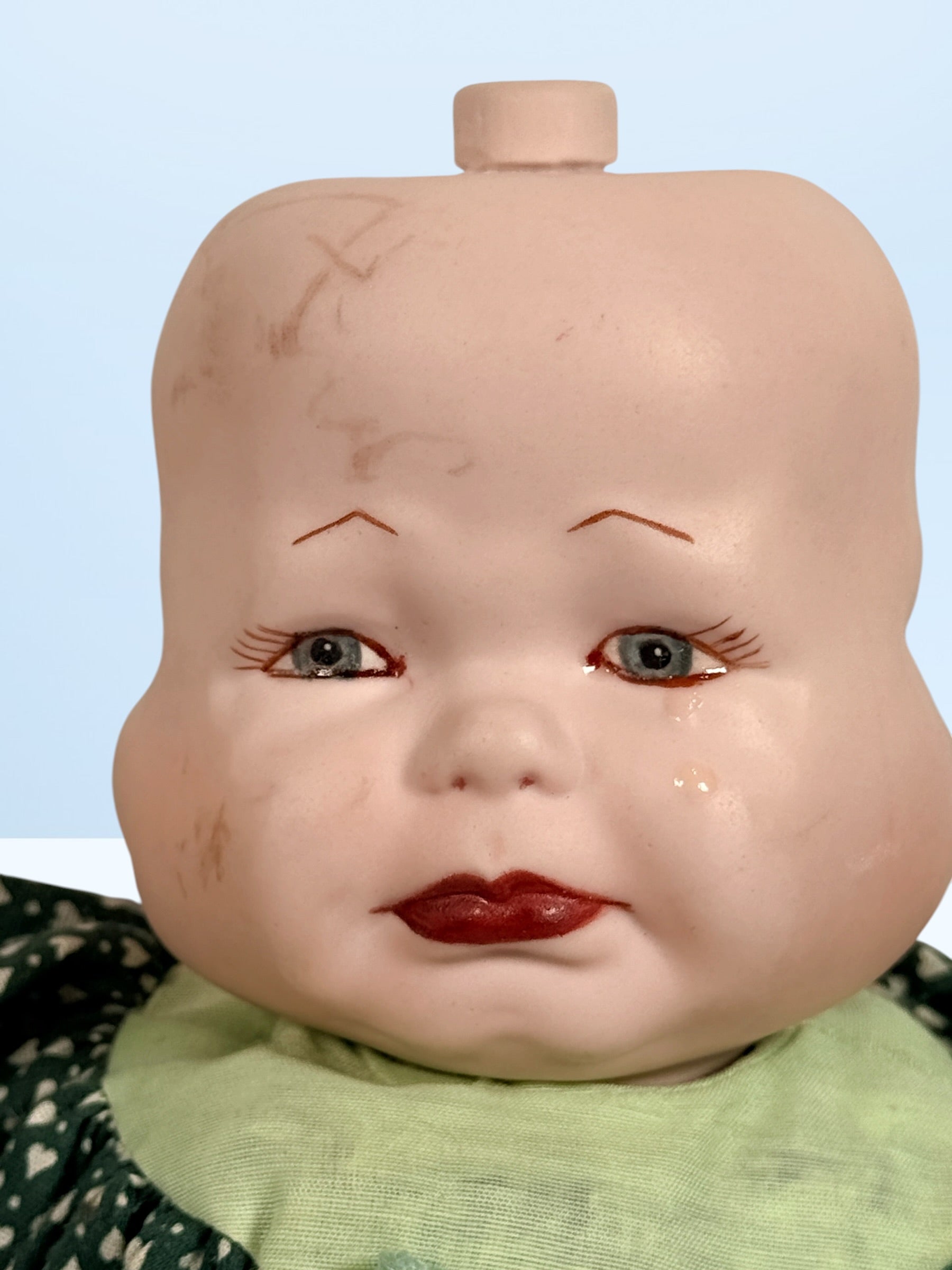 Vintage 1994 three-face baby doll with rotating expressions, lace dress, and novelty design. Rare collectible doll for vintage toy and decor collectors.
