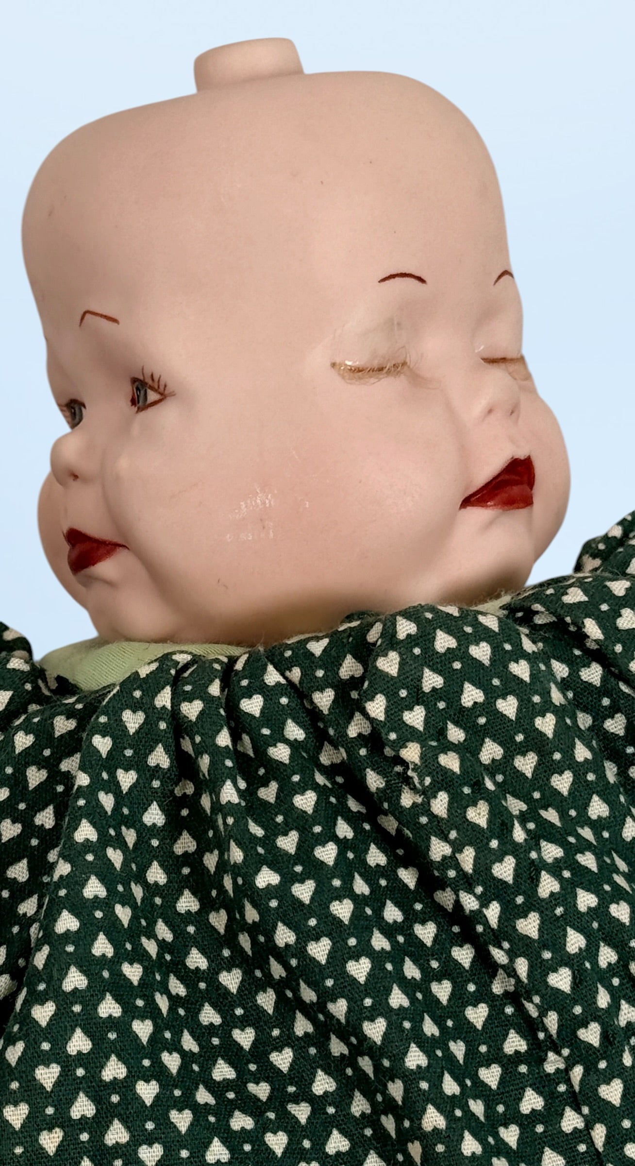 Vintage 1994 three-face baby doll with rotating expressions, lace dress, and novelty design. Rare collectible doll for vintage toy and decor collectors.