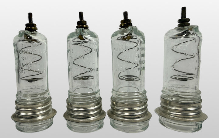 Vintage neon sign glass insulator housing set of 4 marked 7500V and #200. Rare industrial electrical components with internal coils and steampunk decor appeal.