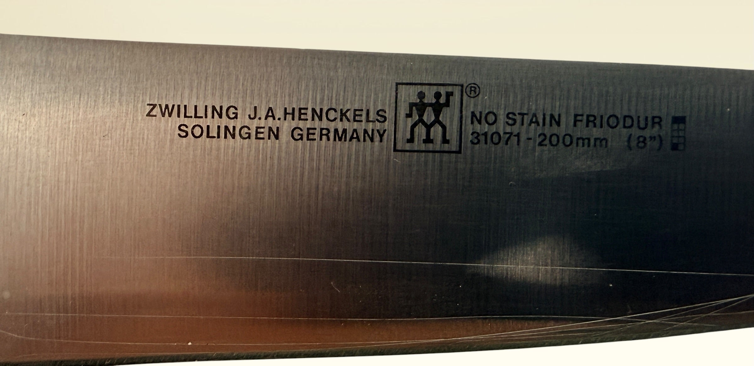 Vintage Zwilling Henckels 8” Friodur chef knife made in Solingen Germany with stainless steel blade and classic ergonomic handle.