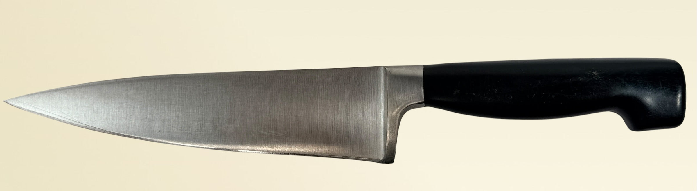 Vintage Zwilling Henckels 8” Friodur chef knife made in Solingen Germany with stainless steel blade and classic ergonomic handle.