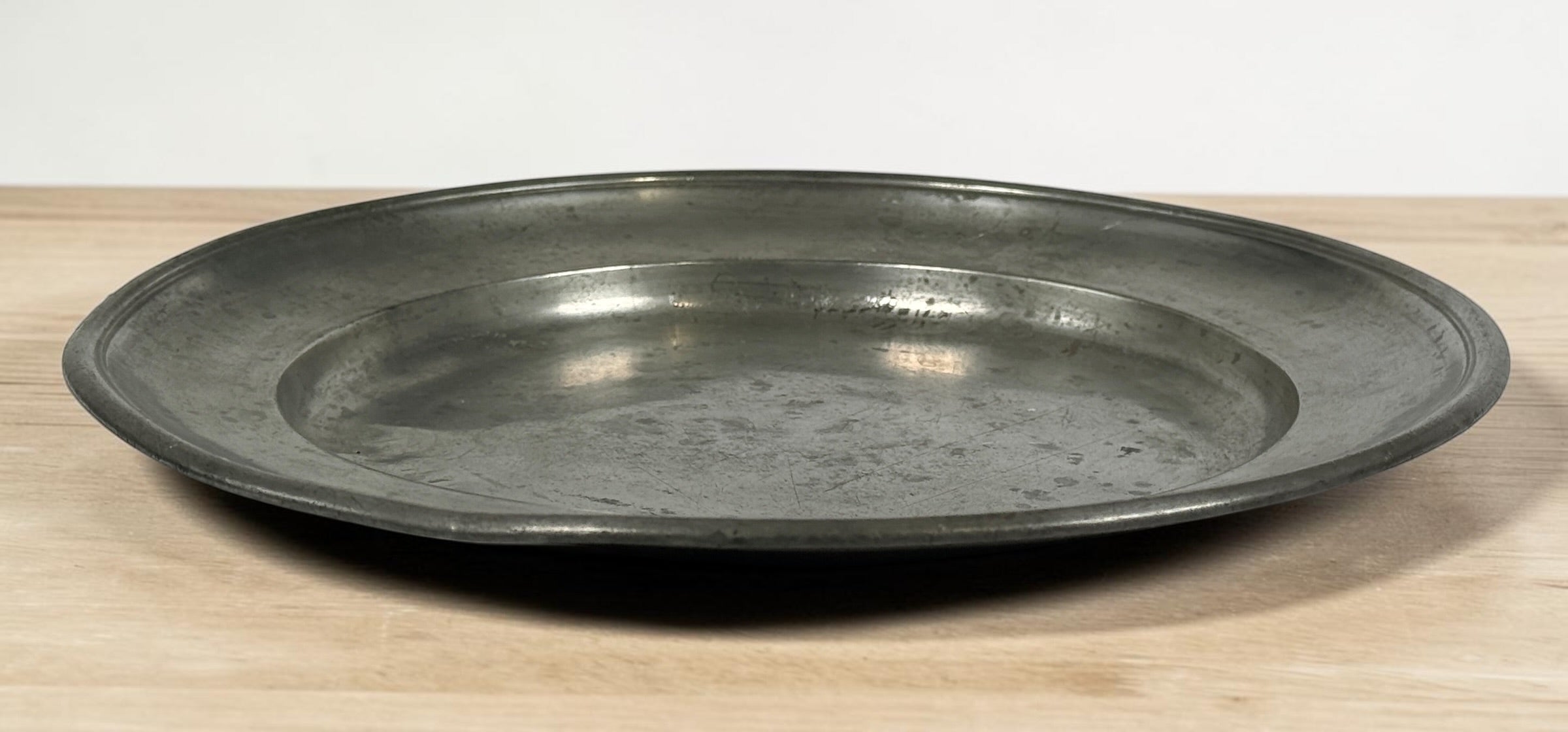 Antique continental pewter charger plate with rare angel marks and K. Winkel touchmarks. Primitive European pewter platter with aged patina.