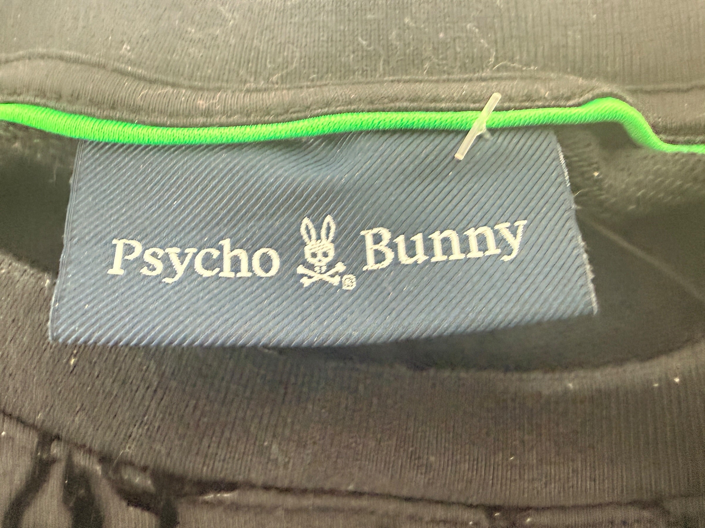 Psycho Bunny skull logo sweatshirt in charcoal grey with all-over flocked graphic print and slim modern streetwear fit.