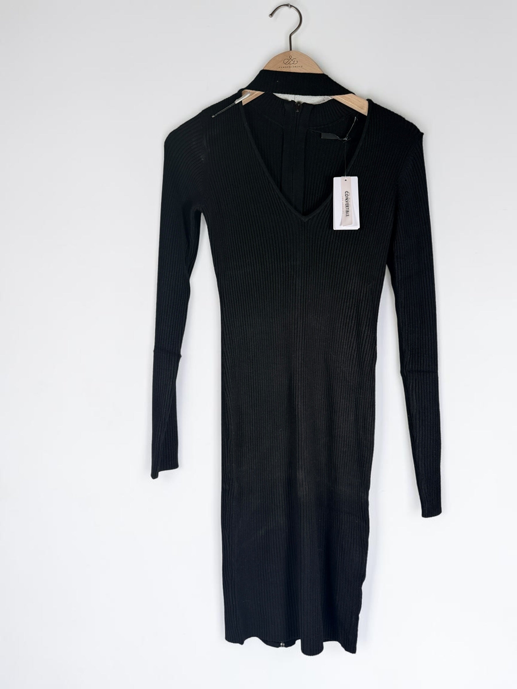GUESS black ribbed knit bodycon dress in size medium, new with tags featuring convertible mock neck and zipper detail.