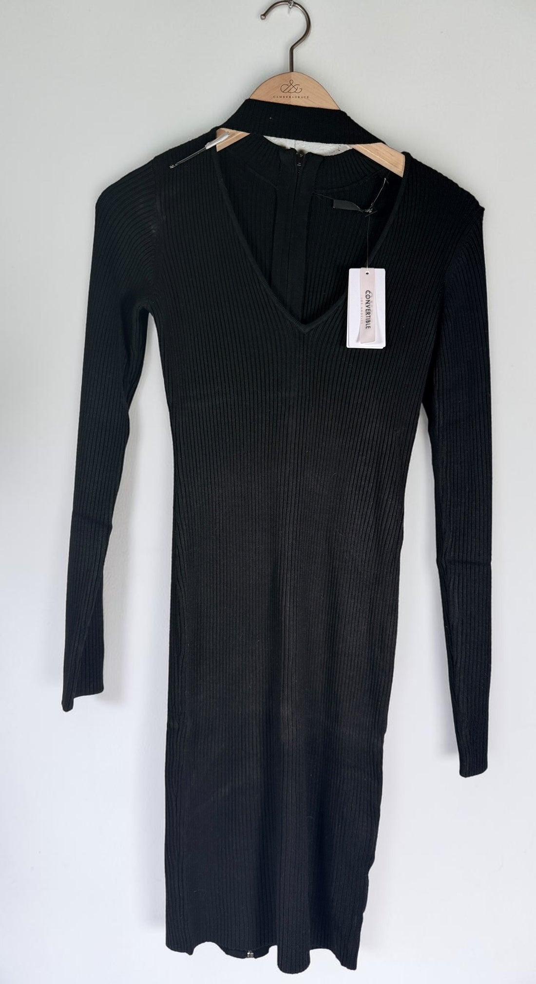 GUESS black ribbed knit bodycon dress in size medium, new with tags featuring convertible mock neck and zipper detail.