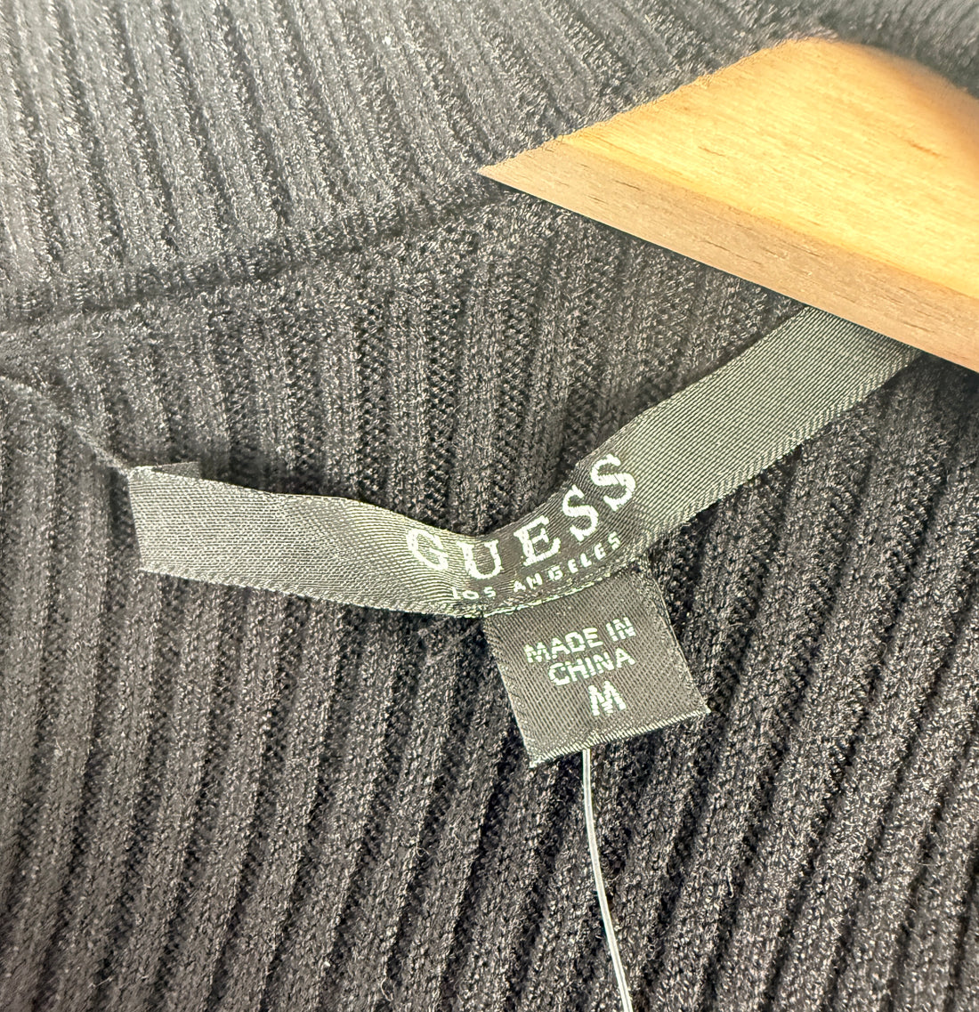 GUESS black ribbed knit bodycon dress in size medium, new with tags featuring convertible mock neck and zipper detail.