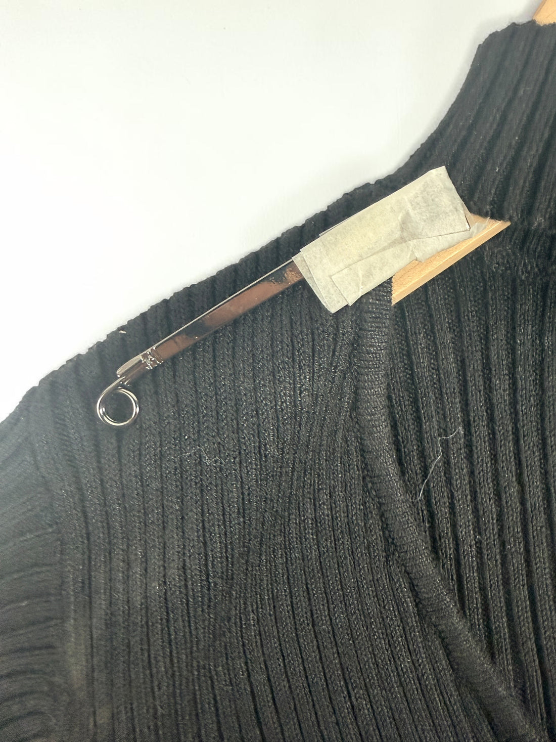GUESS black ribbed knit bodycon dress in size medium, new with tags featuring convertible mock neck and zipper detail.