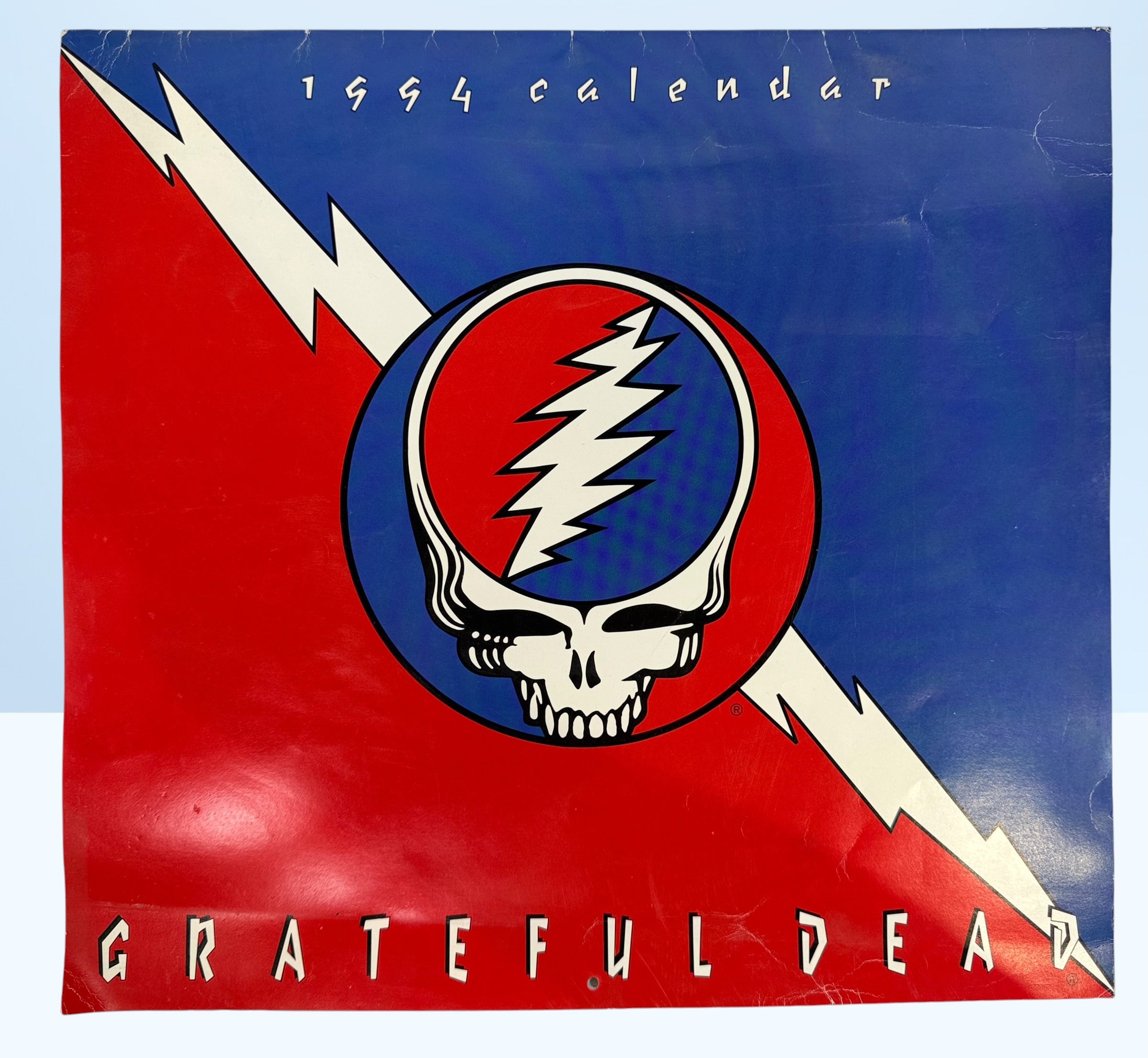 Vintage 1994 Grateful Dead wall calendar with Steal Your Face artwork and concert photography. Official licensed Deadhead collectible memorabili