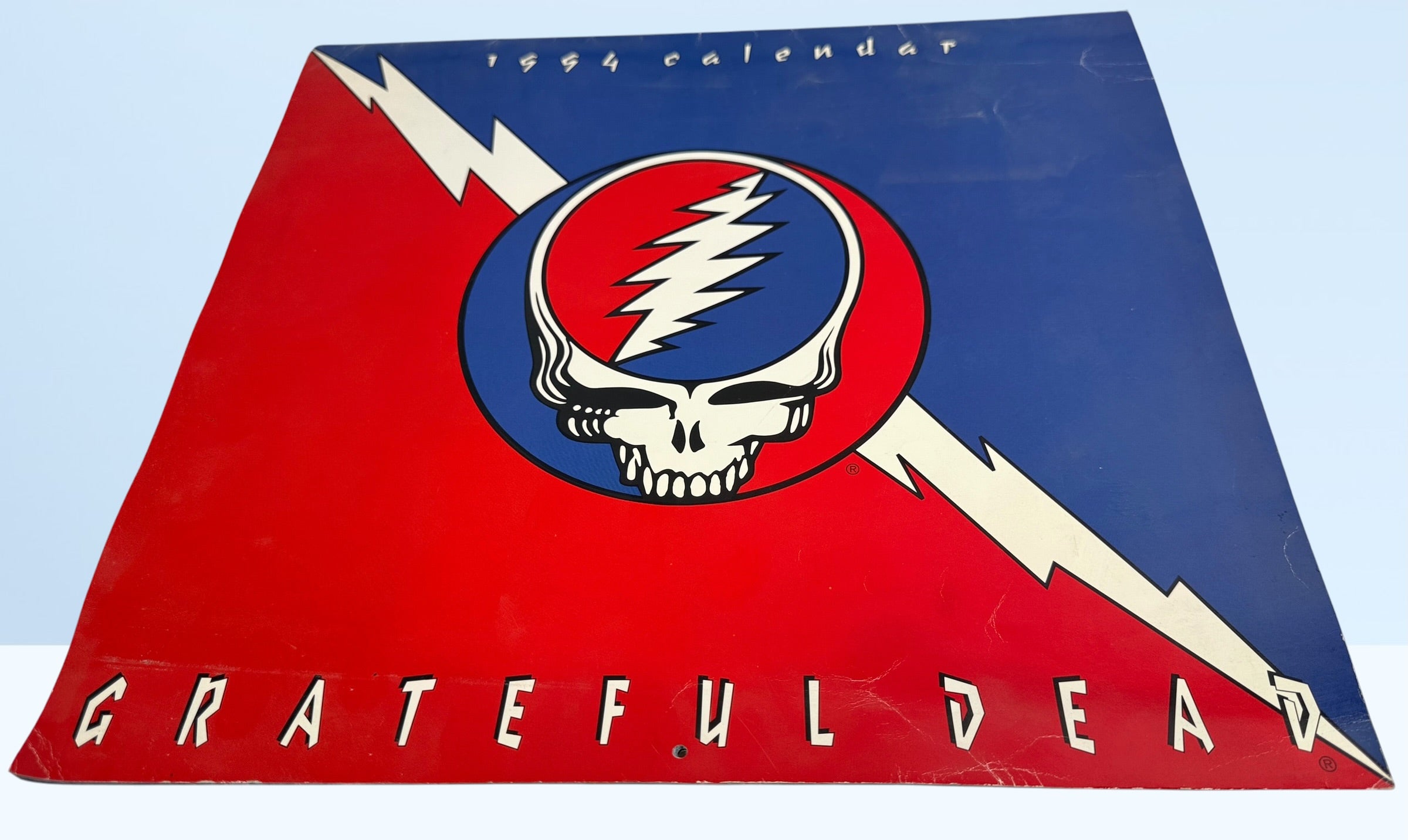 Vintage 1994 Grateful Dead wall calendar with Steal Your Face artwork and concert photography. Official licensed Deadhead collectible memorabili