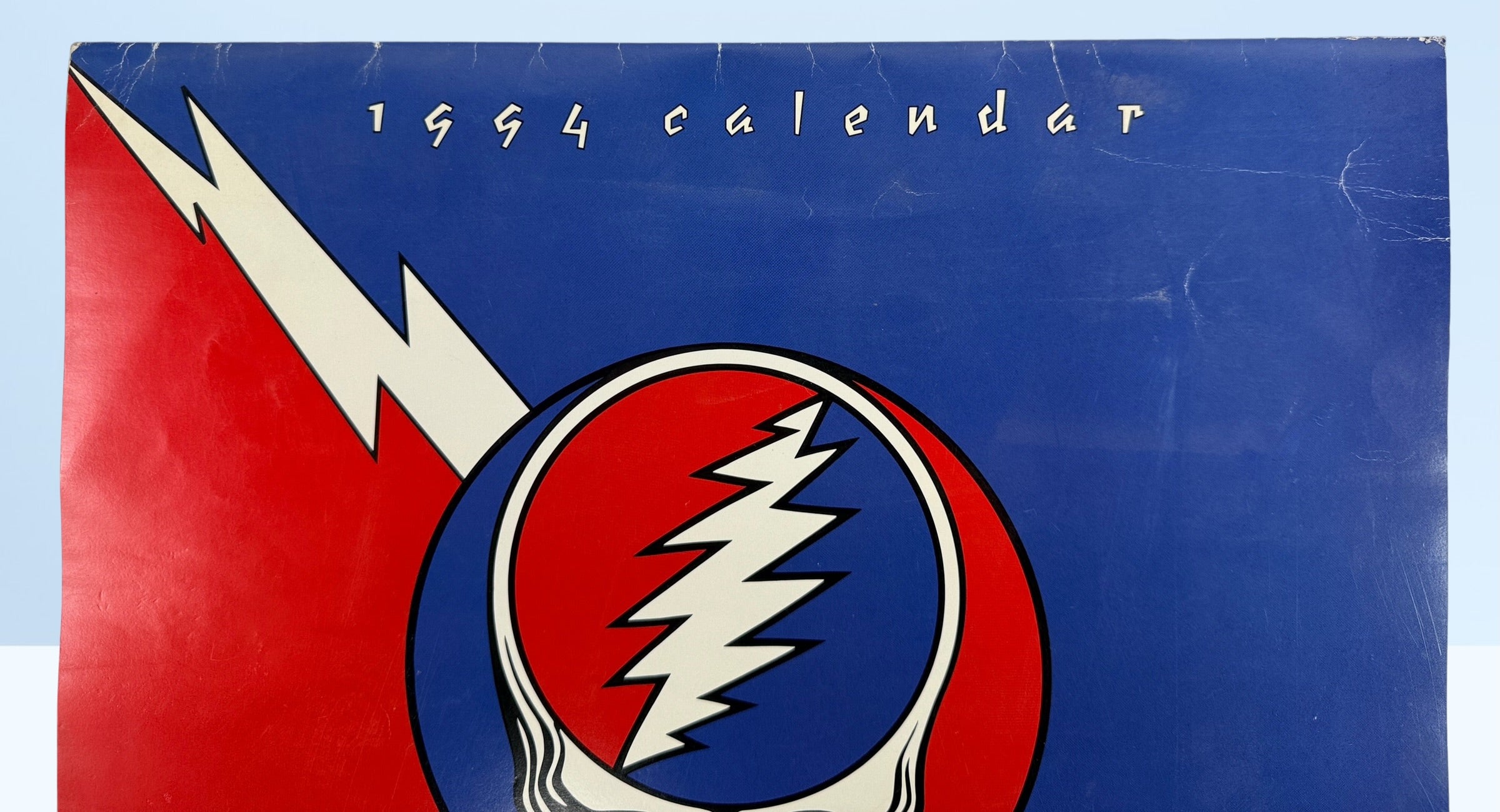 Vintage 1994 Grateful Dead wall calendar with Steal Your Face artwork and concert photography. Official licensed Deadhead collectible memorabili