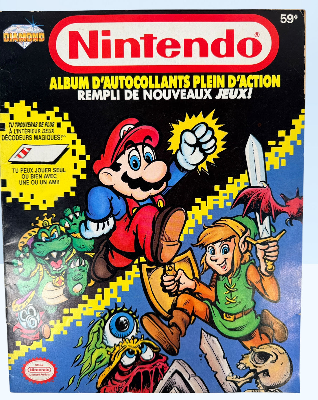 Vintage 1989 Nintendo sticker album in French Canadian edition. Empty NES-era collectible featuring Mario and Zelda artwork and retro gaming nostalgia.