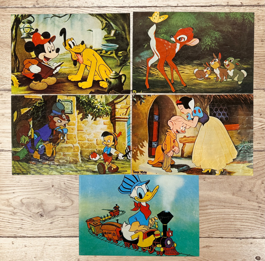 Vintage Walt Disney puzzle block set with original box featuring Snow White, Bambi, Mickey Mouse, Donald Duck, and Pinocchio scenes.