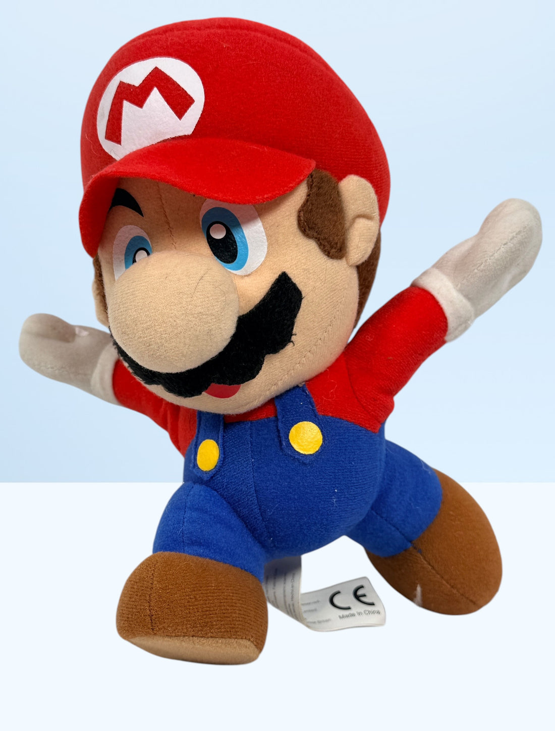 Official 2008 Nintendo Mario plush toy by Corgi Classics in running pose. Great collectible for Super Mario and retro gaming fans.