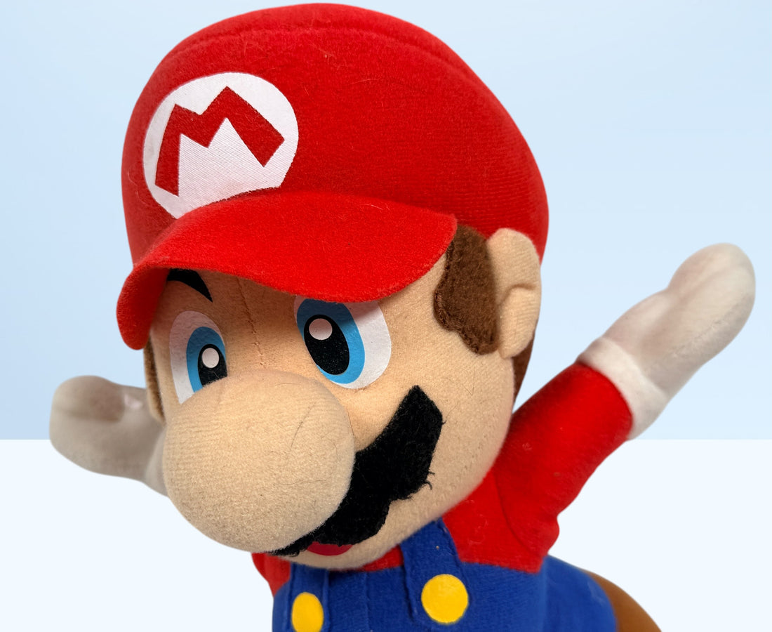 Official 2008 Nintendo Mario plush toy by Corgi Classics in running pose. Great collectible for Super Mario and retro gaming fans.