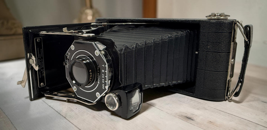 Vintage Kodak Junior Six-16 folding camera made in Canada with working shutter and intact bellows. Classic Art Deco Kodak collectible camera.