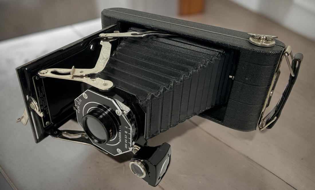 Vintage Kodak Junior Six-16 folding camera made in Canada with working shutter and intact bellows. Classic Art Deco Kodak collectible camera.