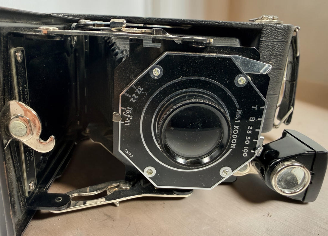 Vintage Kodak Junior Six-16 folding camera made in Canada with working shutter and intact bellows. Classic Art Deco Kodak collectible camera.