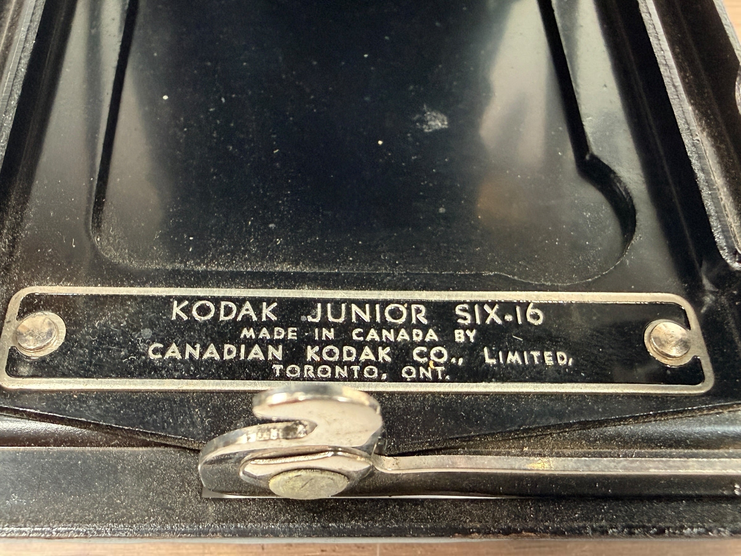 Vintage Kodak Junior Six-16 folding camera made in Canada with working shutter and intact bellows. Classic Art Deco Kodak collectible camera.