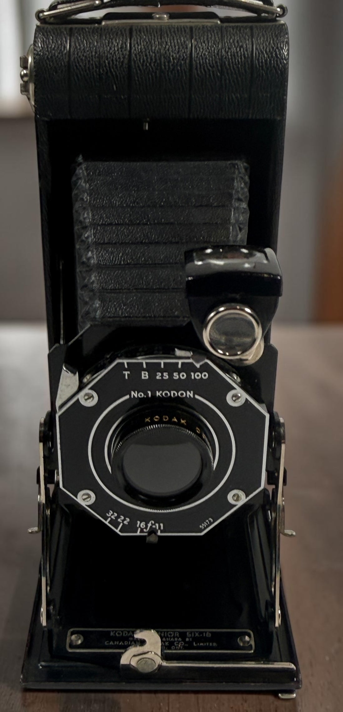 Vintage Kodak Junior Six-16 folding camera made in Canada with working shutter and intact bellows. Classic Art Deco Kodak collectible camera.