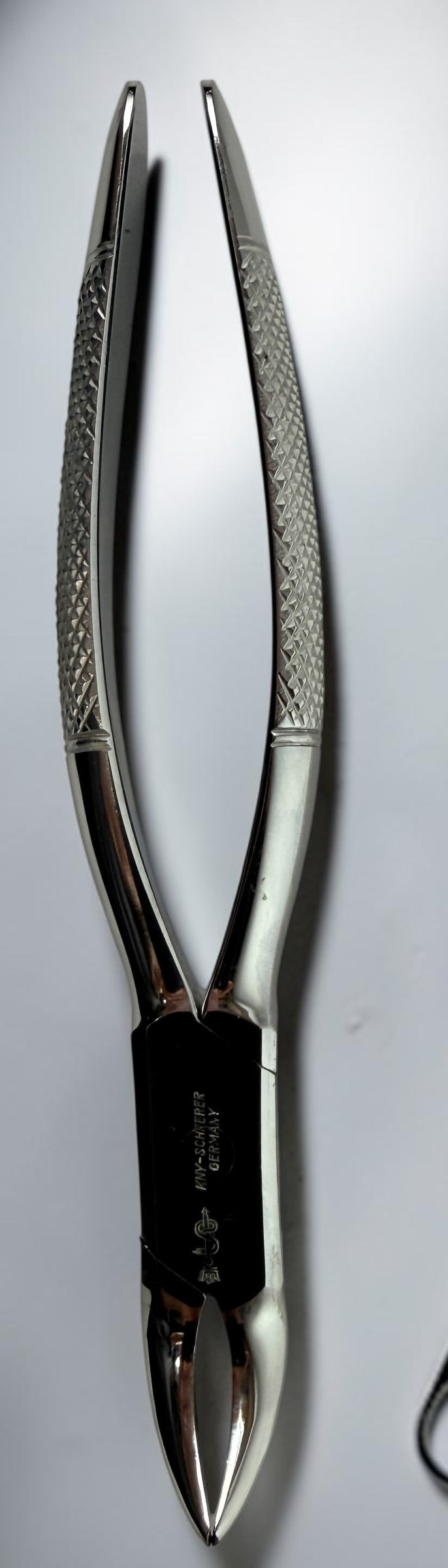 Vintage KNY Scherrer German dental extraction forceps No. 72. Chrome-plated oral surgery instrument collectible in very good vintage condition.