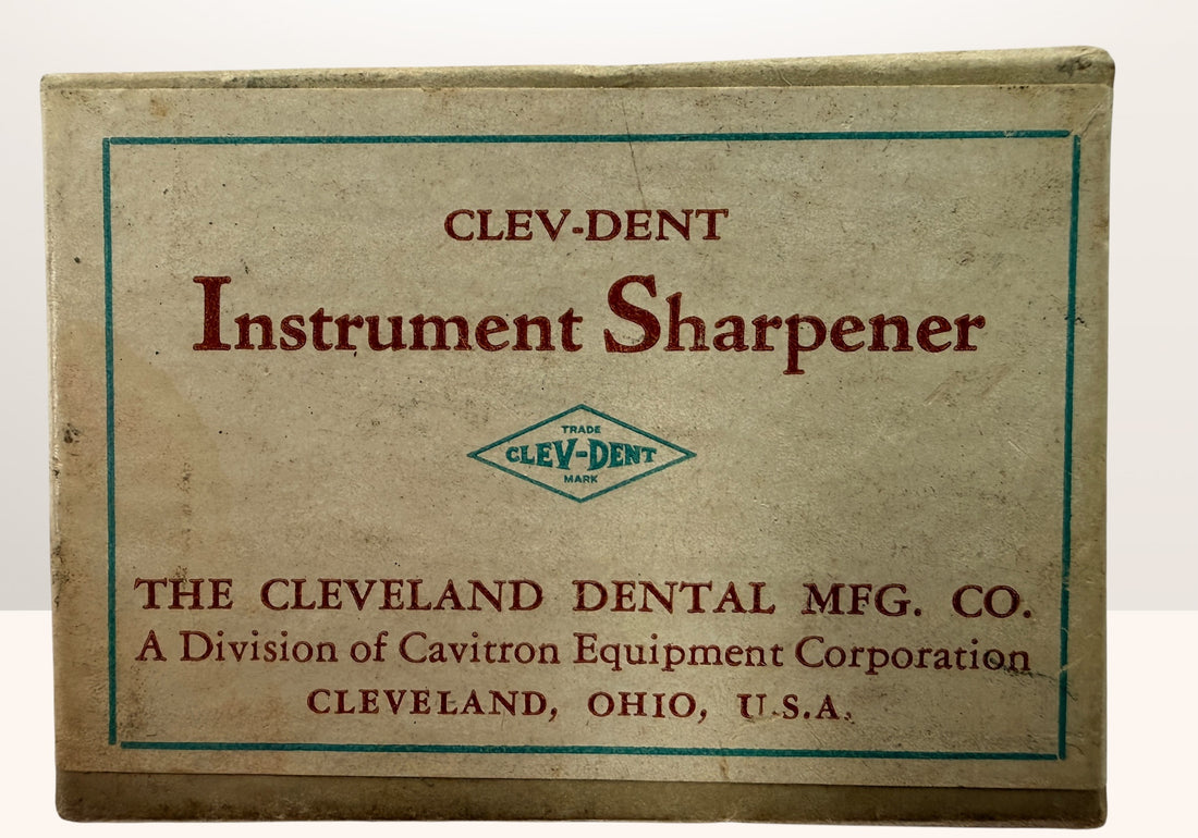 Vintage Clev-Dent dental instrument sharpener with original box, mid-century USA dental collectible and medical antique display piece.
