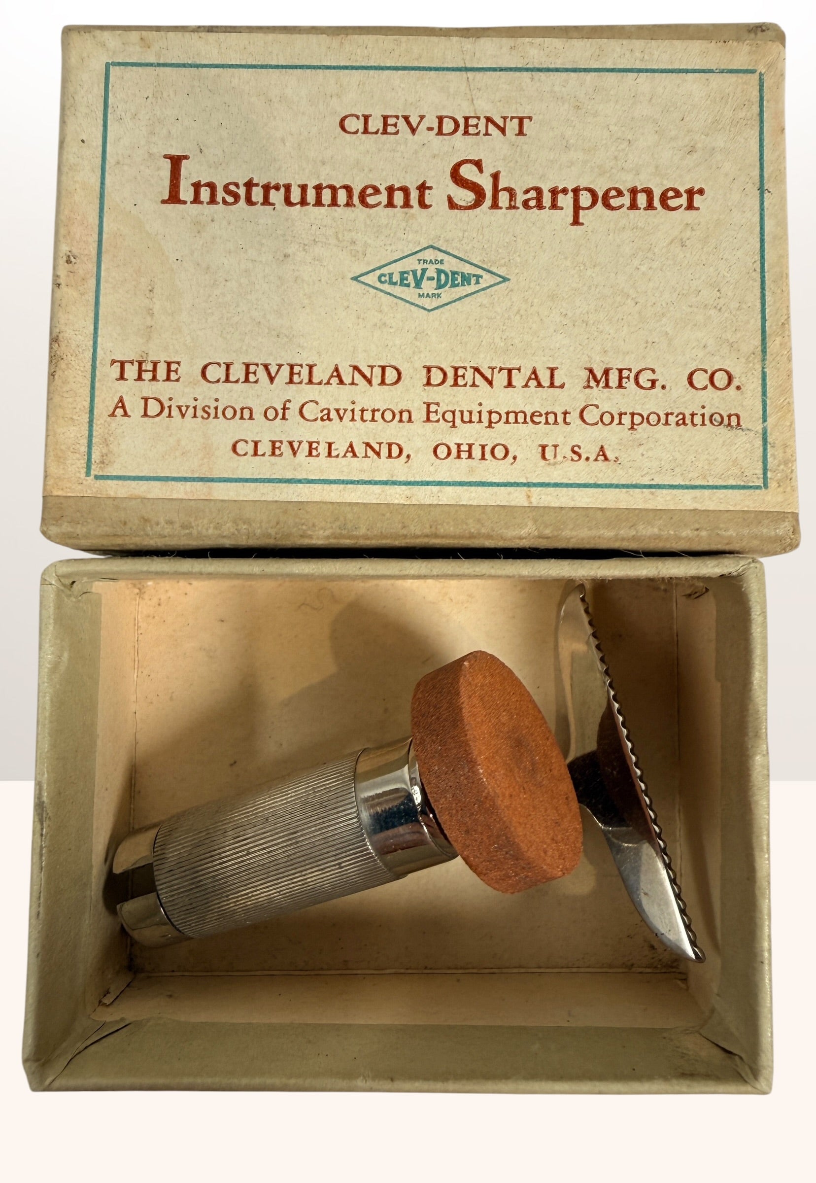 Vintage Clev-Dent dental instrument sharpener with original box, mid-century USA dental collectible and medical antique display piece.