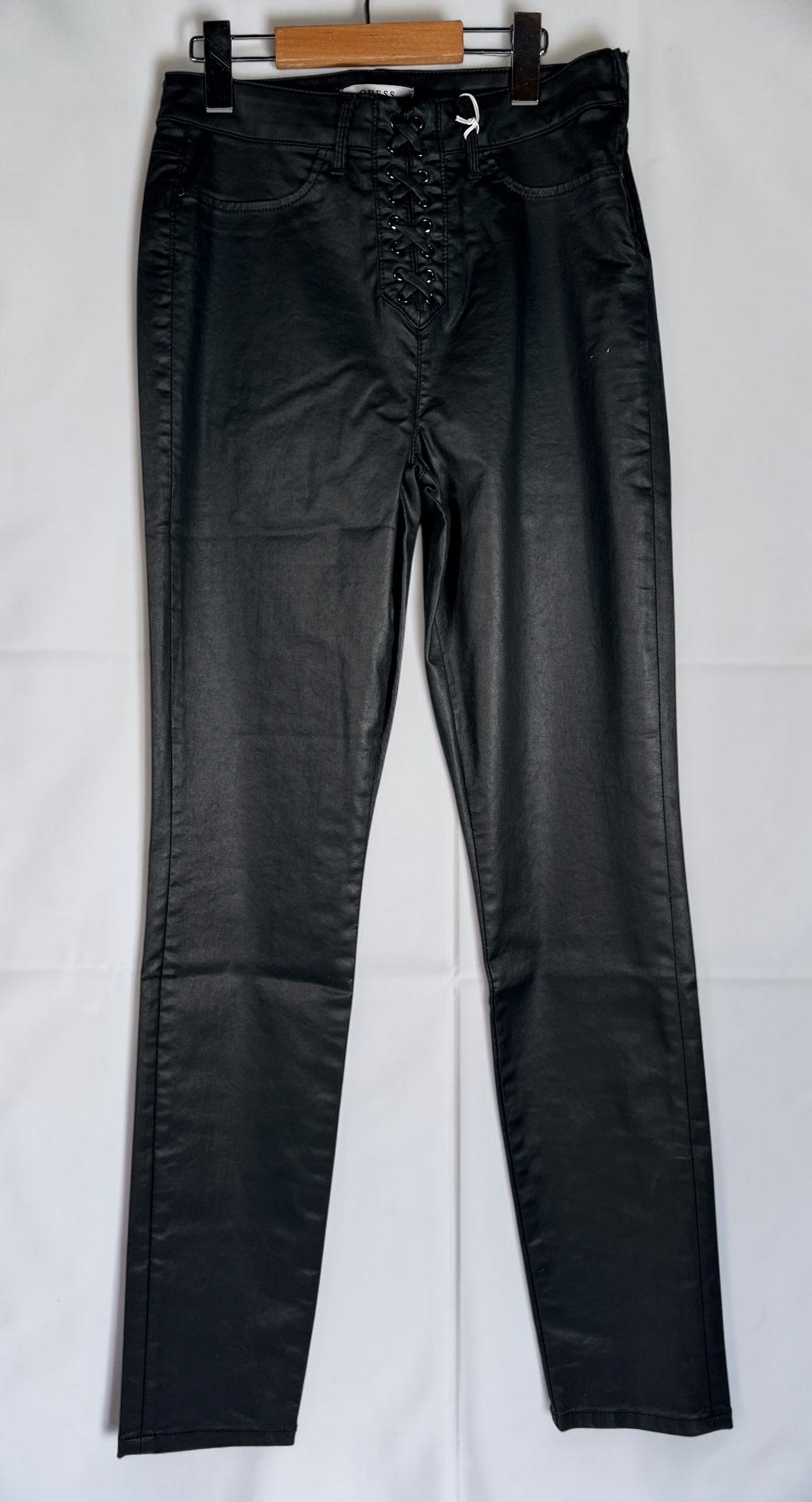 GUESS lace-up coated skinny pants in black Noir Gemstone Wash, size 29. Faux leather look with stretch comfort, original tags attached, and stylish contemporary fit.