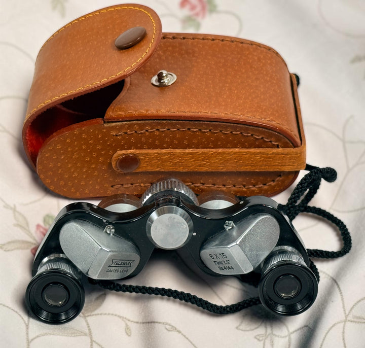 Vintage Telesar 6x15 pocket binoculars with original carrying case. Compact Japanese field glasses with coated lenses and classic mid-century styling.