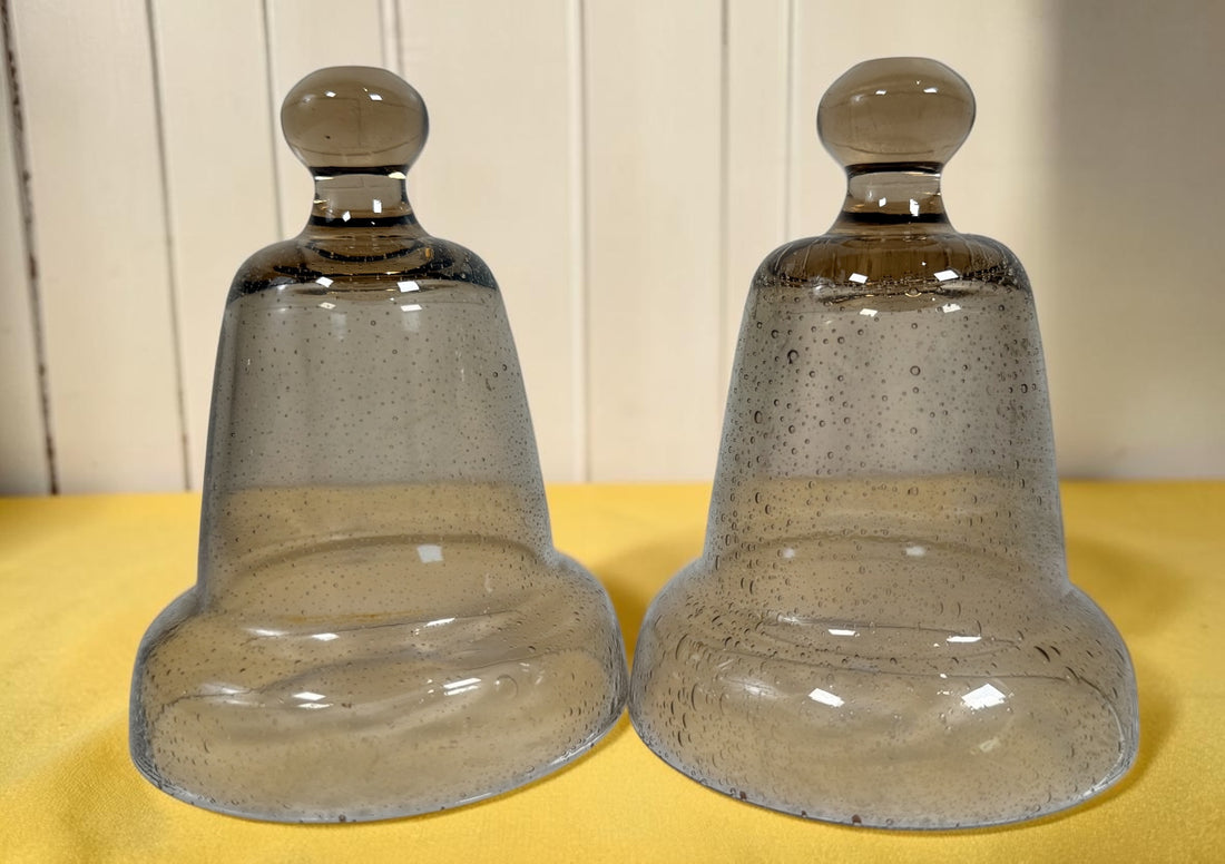 Vintage pair of mercury glass garden cloches with bell jar design and clear finials. Decorative plant covers ideal for garden or home display.