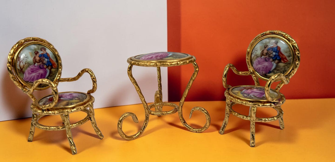 Vintage Limoges France miniature porcelain salon set with gilt metal chairs and table. Elegant French collectible featuring hand-painted romantic scenes.