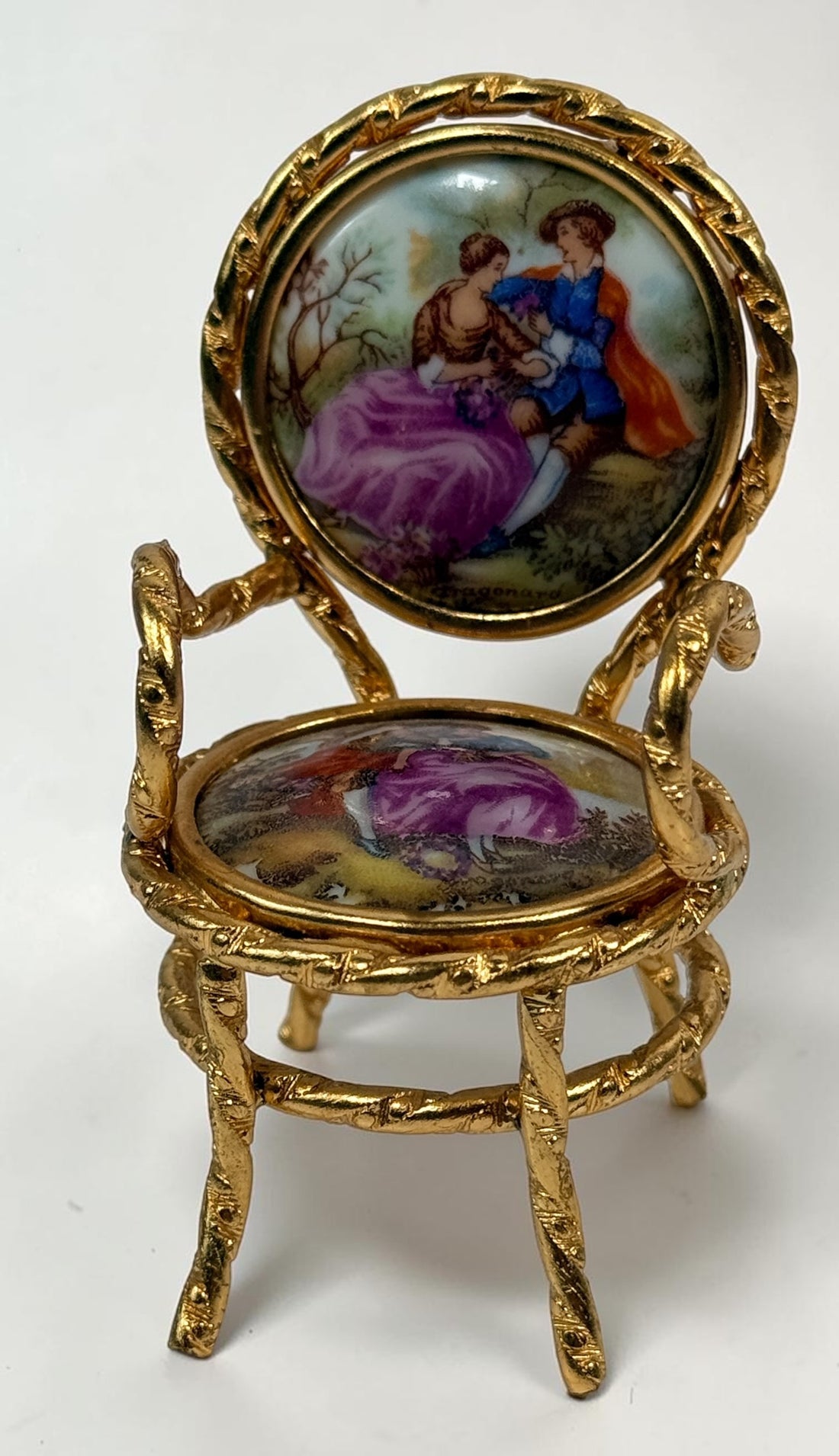 Vintage Limoges France miniature porcelain salon set with gilt metal chairs and table. Elegant French collectible featuring hand-painted romantic scenes.