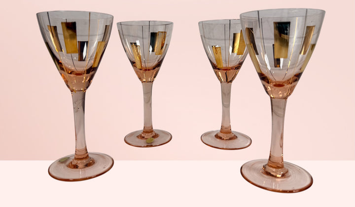 Vintage Hungarian pink cocktail glasses with gold atomic decoration. Set of 4 Mid-Century Modern cordial glasses, ideal for retro barware collections.