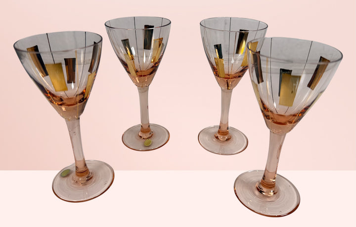 Vintage Hungarian pink cocktail glasses with gold atomic decoration. Set of 4 Mid-Century Modern cordial glasses, ideal for retro barware collections.