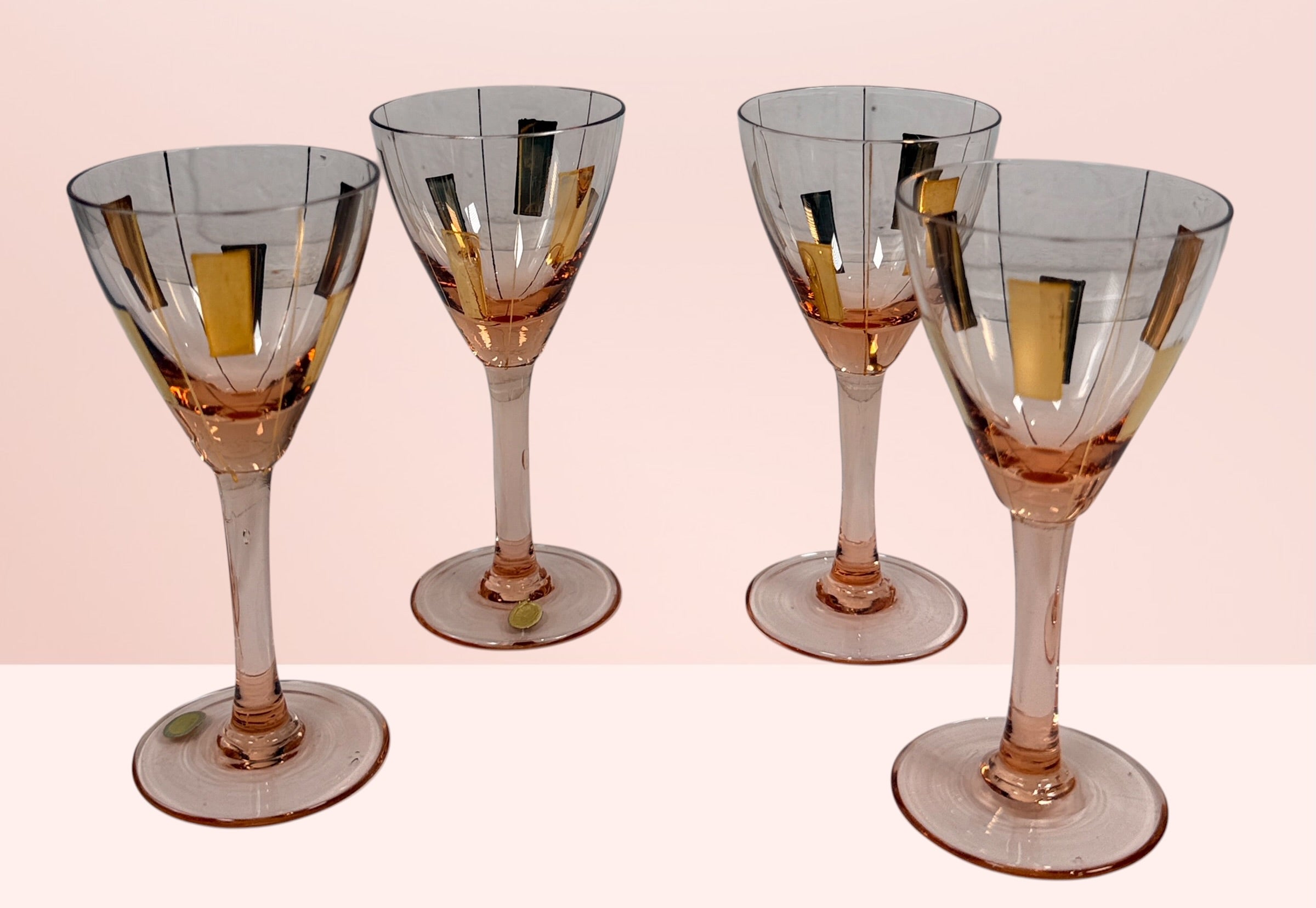 Vintage Hungarian pink cocktail glasses with gold atomic decoration. Set of 4 Mid-Century Modern cordial glasses, ideal for retro barware collections.