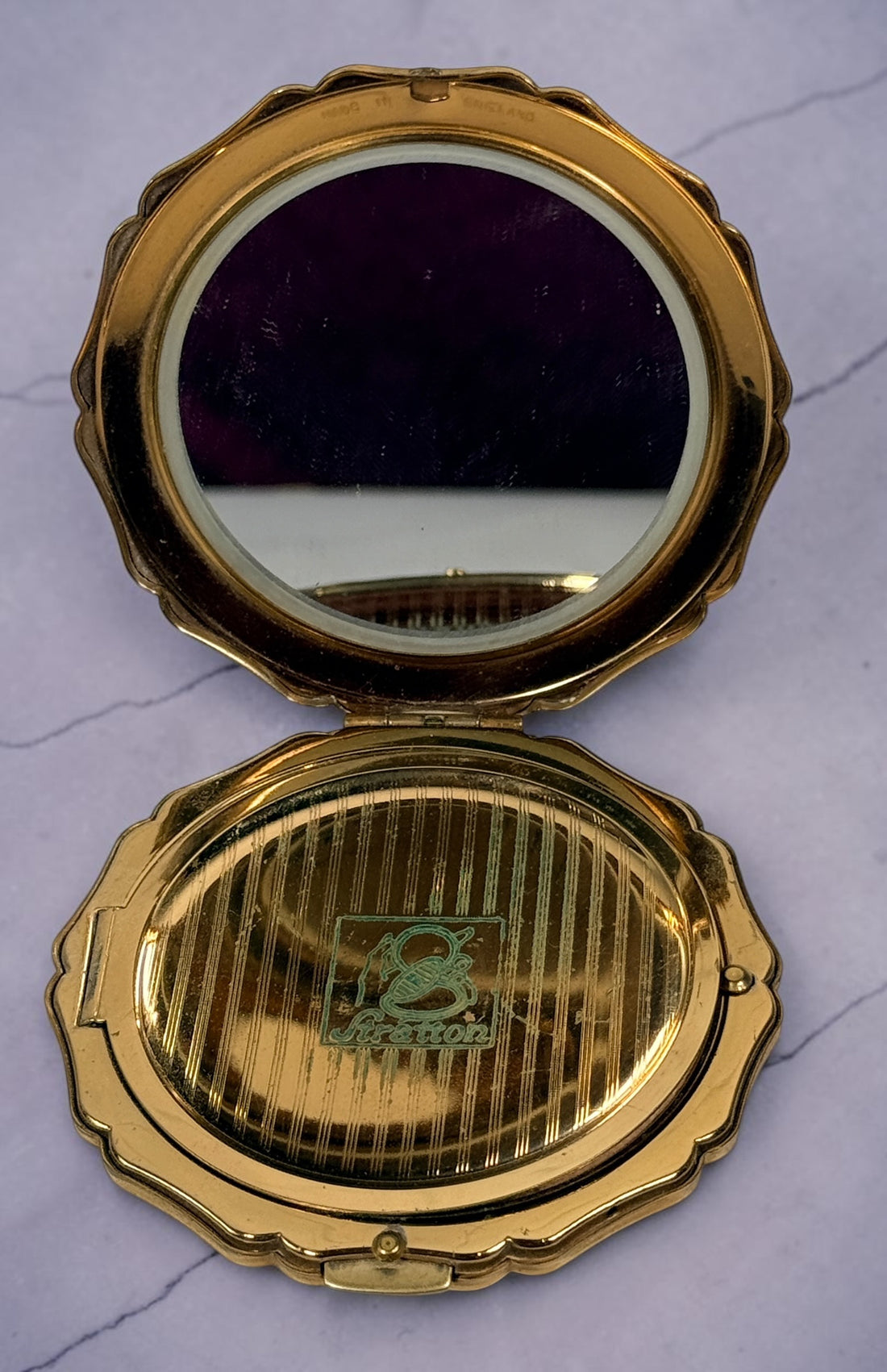Vintage Stratton blue enamel powder compact made in England. Elegant gold-tone vanity accessory from the 1960s–1970s with mirror and original styling.