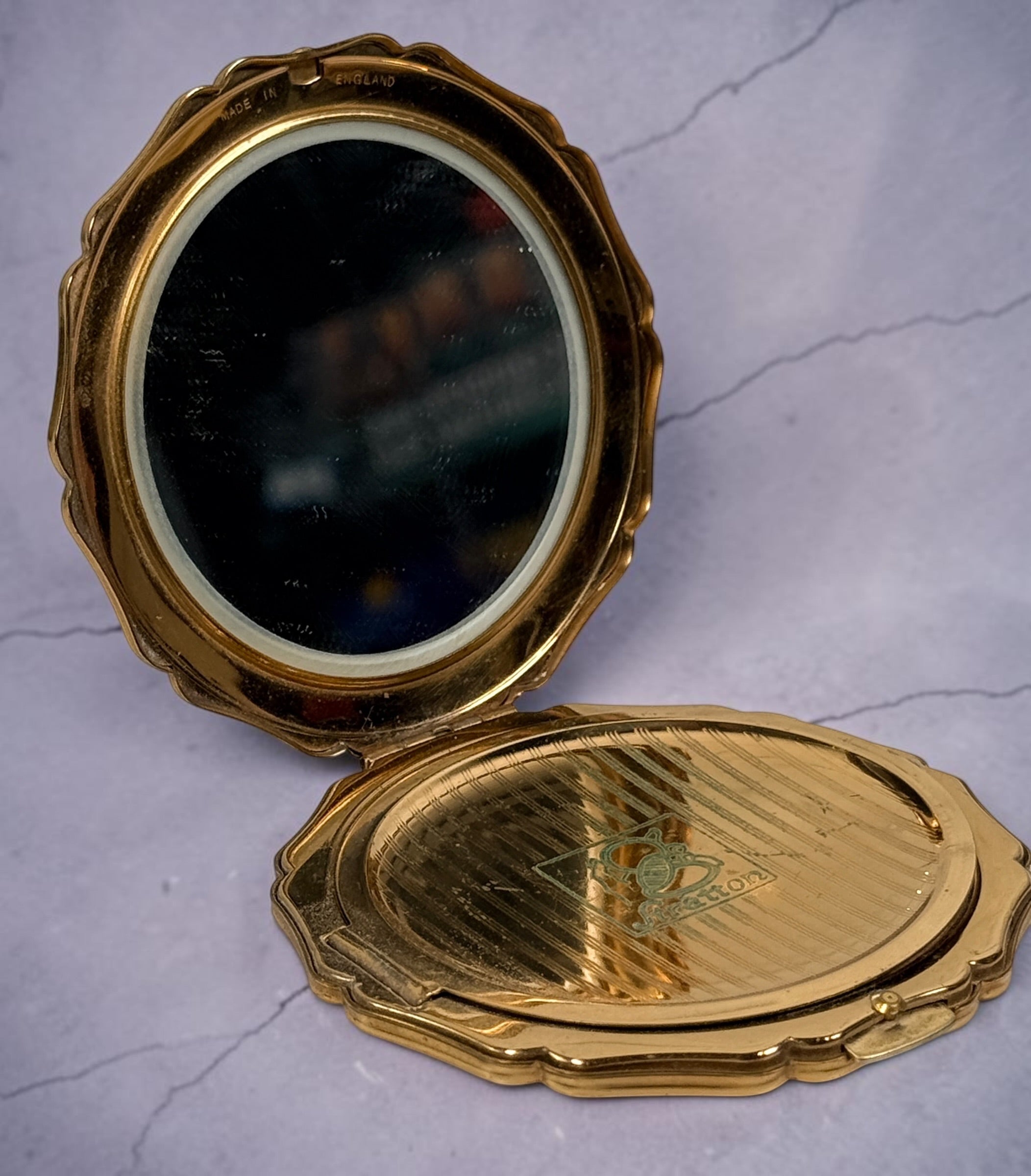 Vintage Stratton blue enamel powder compact made in England. Elegant gold-tone vanity accessory from the 1960s–1970s with mirror and original styling.