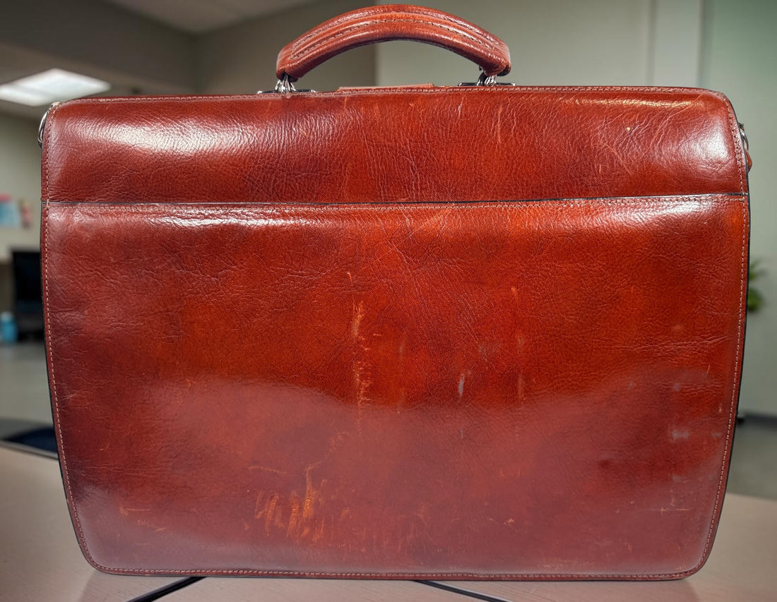 Authentic Jack Georges triple gusset leather briefcase in cognac brown featuring full-grain leather, locking closure, and spacious executive organization.