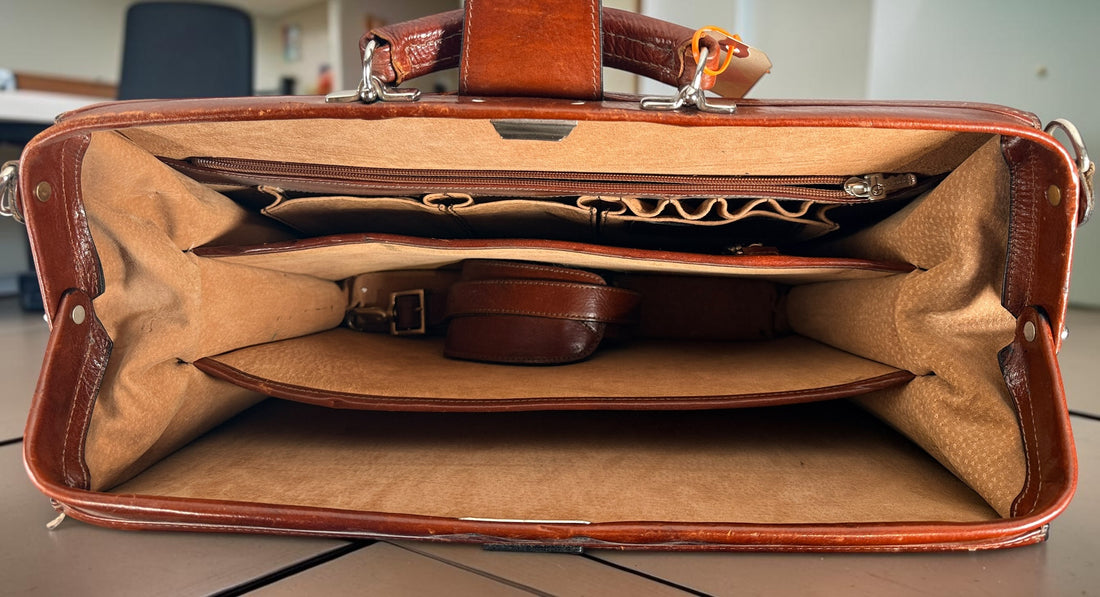 Authentic Jack Georges triple gusset leather briefcase in cognac brown featuring full-grain leather, locking closure, and spacious executive organization.