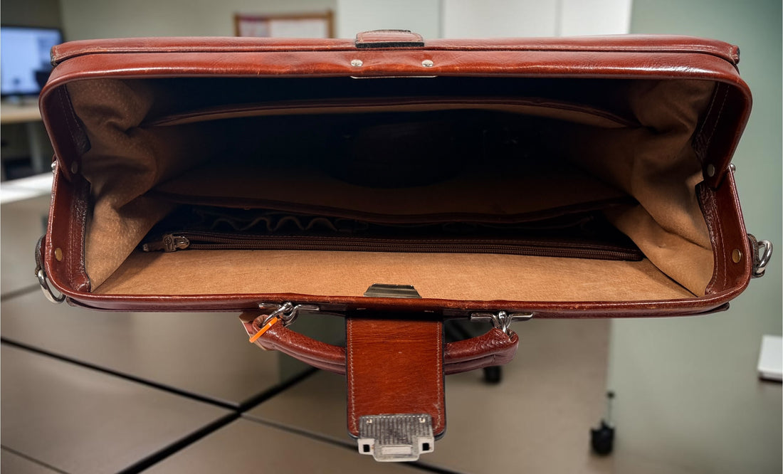 Authentic Jack Georges triple gusset leather briefcase in cognac brown featuring full-grain leather, locking closure, and spacious executive organization.