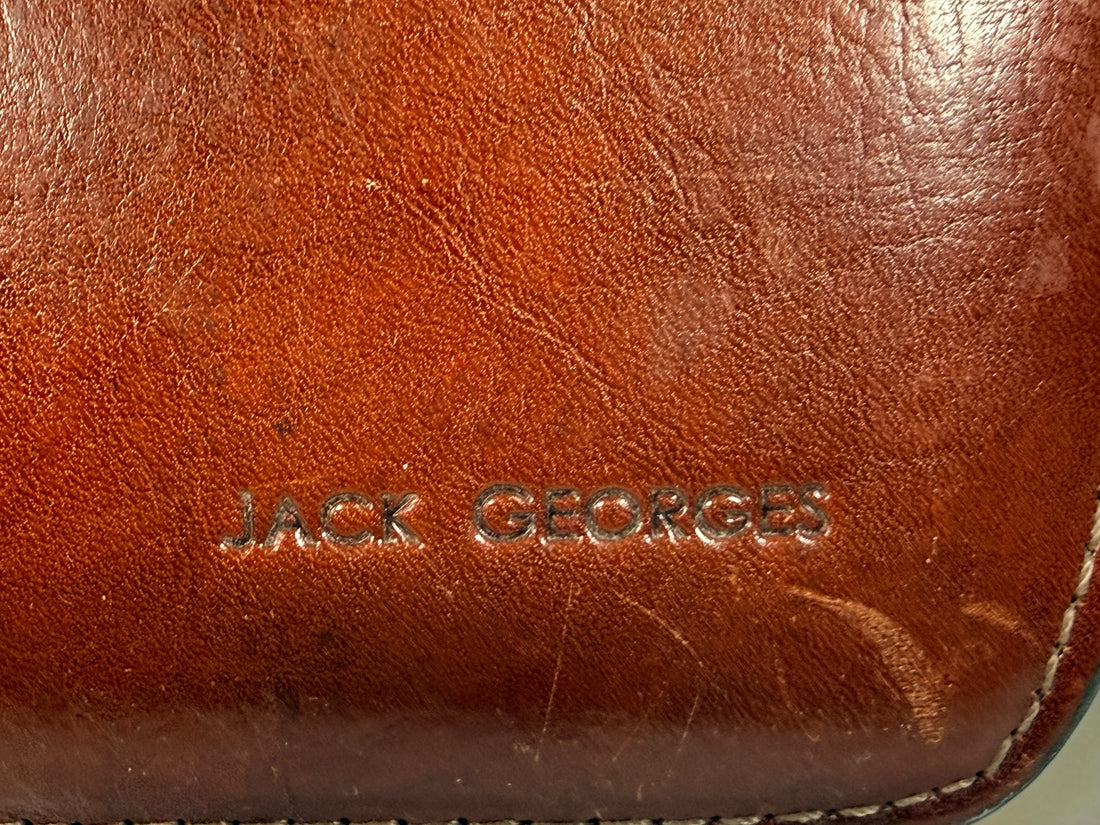 Authentic Jack Georges triple gusset leather briefcase in cognac brown featuring full-grain leather, locking closure, and spacious executive organization.