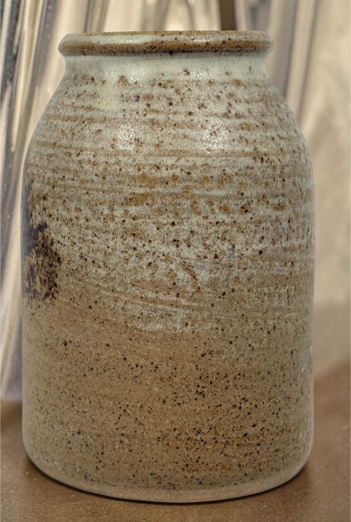 Vintage studio pottery stoneware vase featuring a hand-decorated tree motif and rustic earth-tone glaze. A charming handmade decorative ceramic piece.