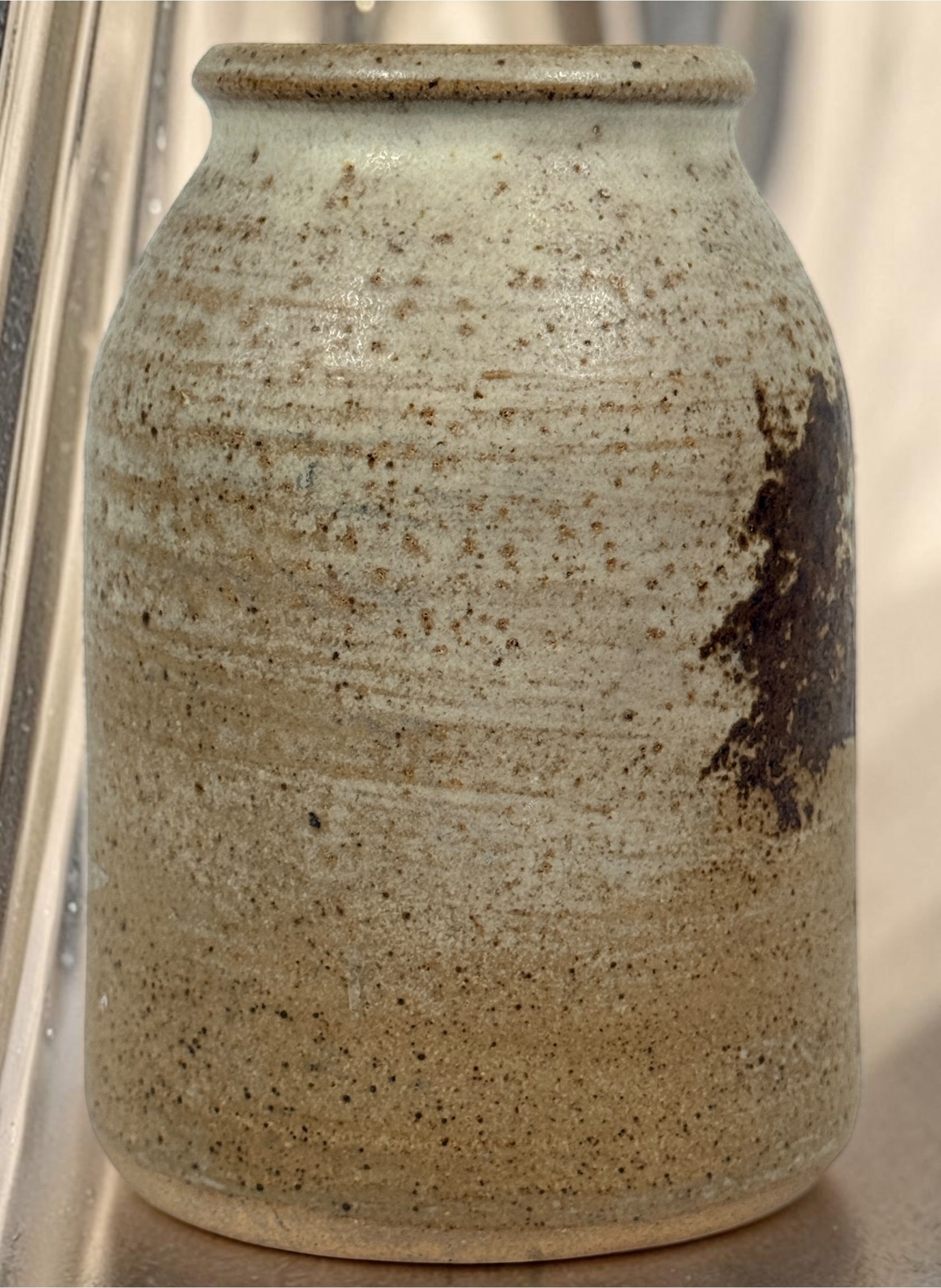 Vintage studio pottery stoneware vase featuring a hand-decorated tree motif and rustic earth-tone glaze. A charming handmade decorative ceramic piece.