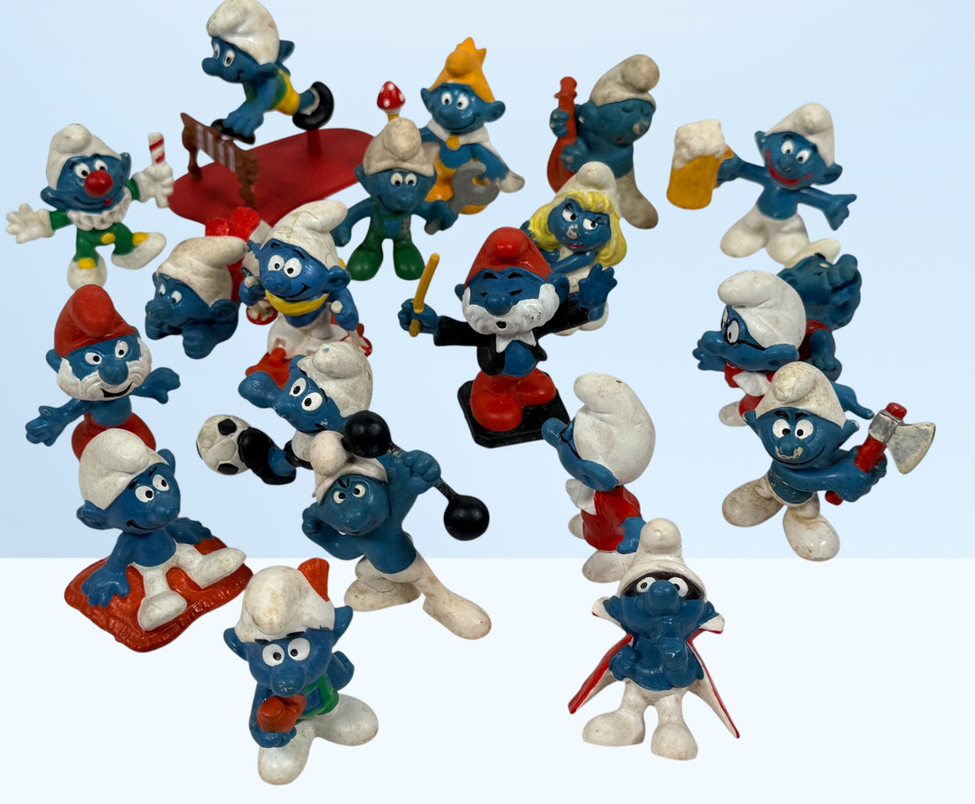 Vintage Peyo Smurf figure lot featuring 20 authentic West Germany Schleich PVC figures from the 1980s. Classic collectible characters in fair to good condition.