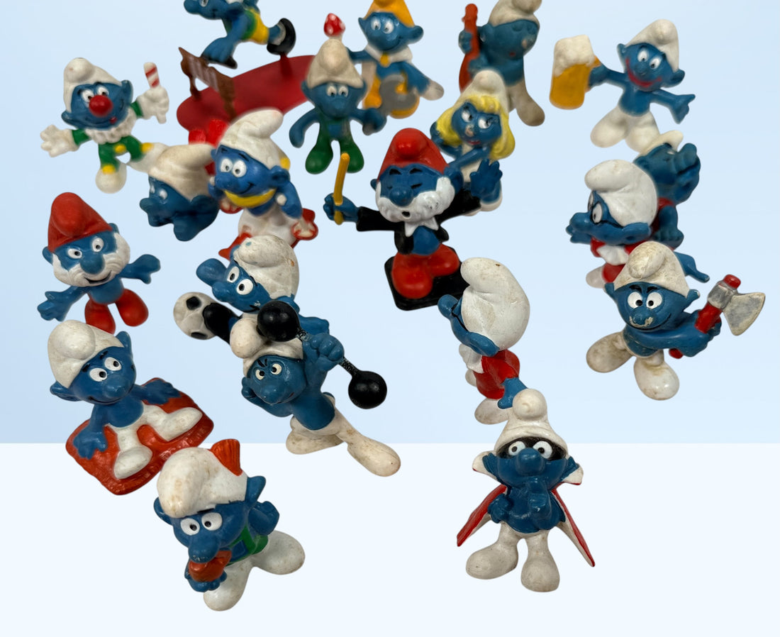 Vintage Peyo Smurf figure lot featuring 20 authentic West Germany Schleich PVC figures from the 1980s. Classic collectible characters in fair to good condition.