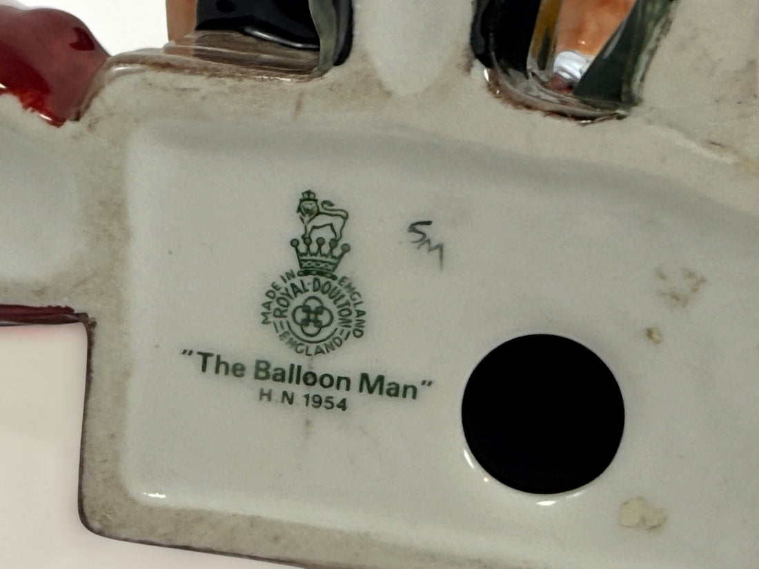Vintage Royal Doulton The Balloon Man HN1954 porcelain figurine from England. Classic Leslie Harradine design in good collectible condition.