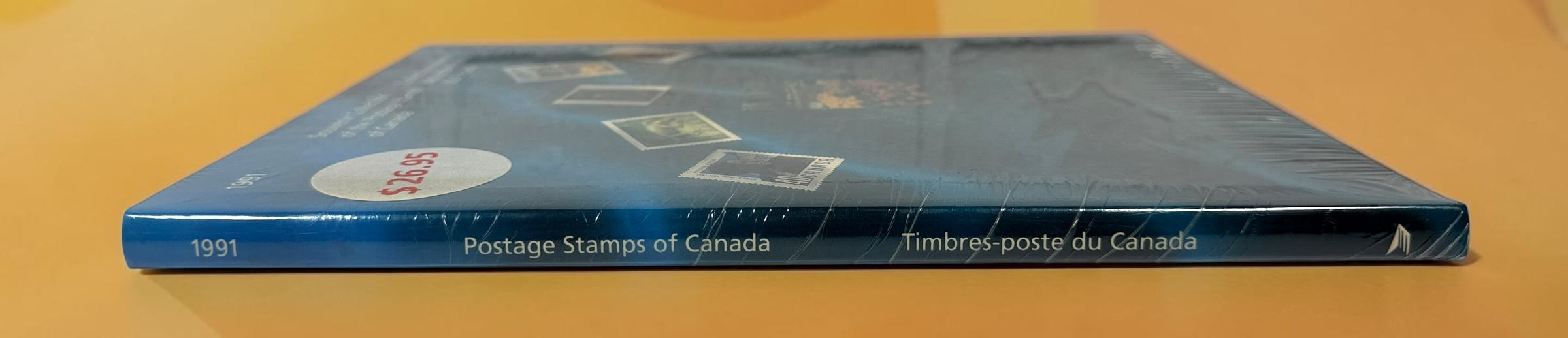 Factory-sealed 1991 Canada Post Stamp Collection Yearbook featuring 61 mint Canadian stamps, bilingual content, and original Canada Post presentation.
