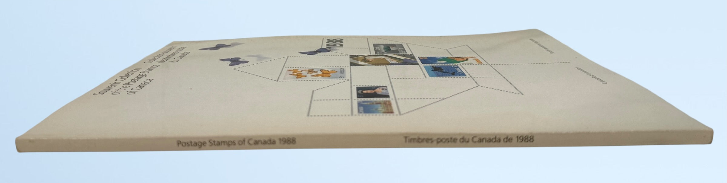 Official Canada Post 1988 stamp collection album featuring mint Canadian commemorative and definitive stamps, Olympics, wildlife, butterflies, and Canadiana themes.