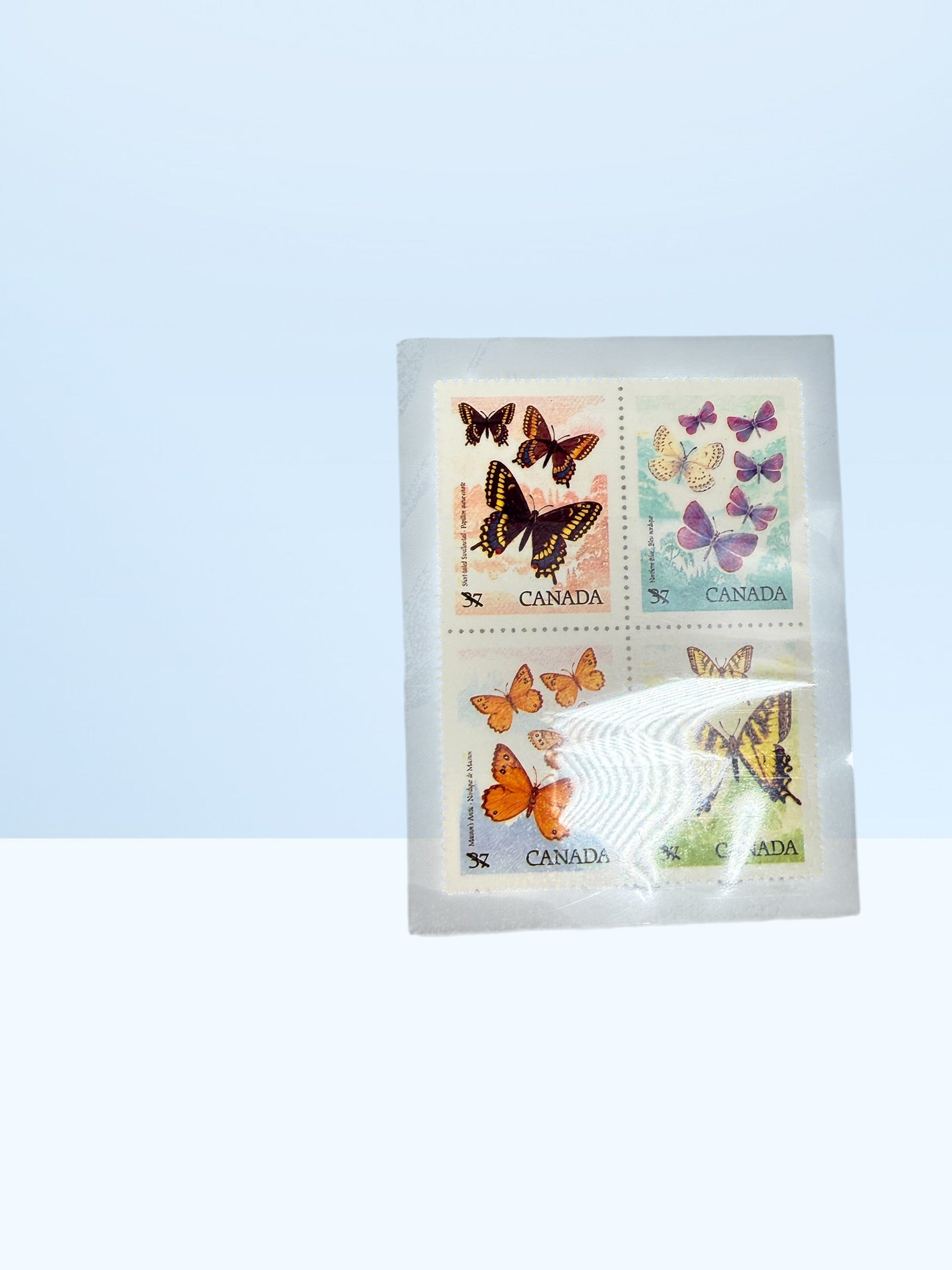 Official Canada Post 1988 stamp collection album featuring mint Canadian commemorative and definitive stamps, Olympics, wildlife, butterflies, and Canadiana themes.